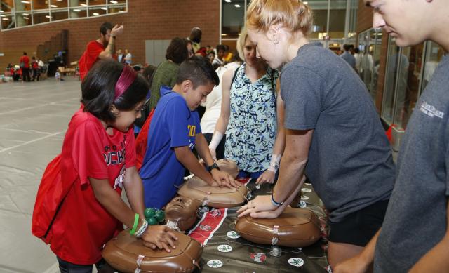 Kids practice CPR at the 2018 Family Wellness Expo