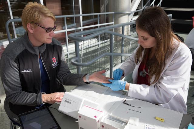 A participant is having her hemoglobin A1c tested by a nurse practitioner
