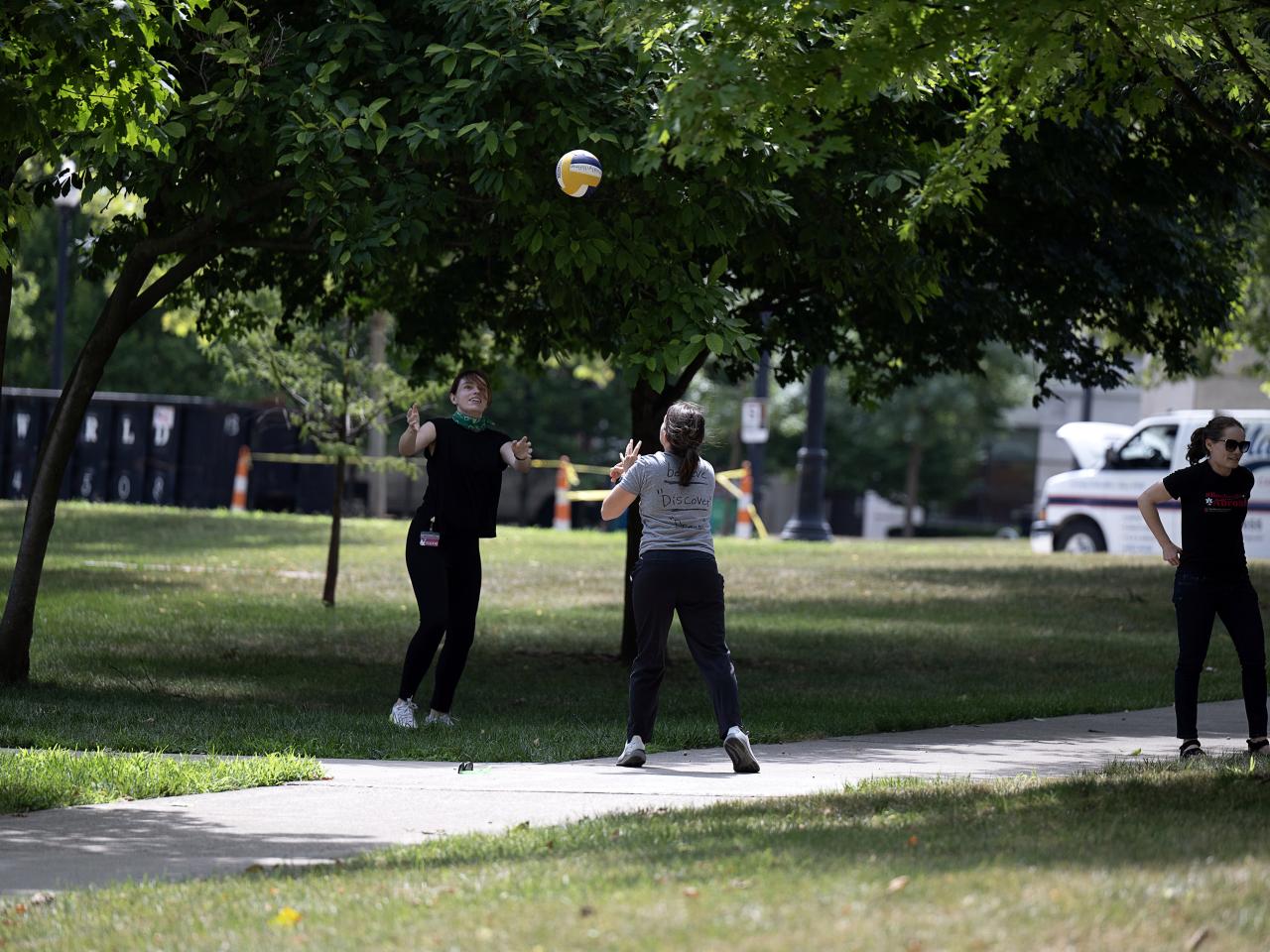 Team members playing volleyball