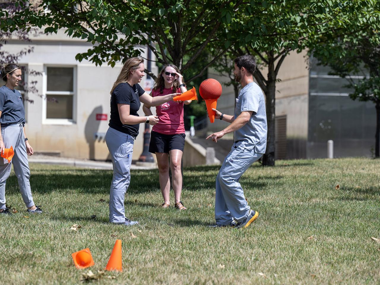 Team members participating in a relay race